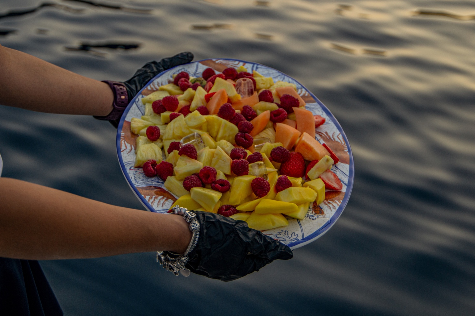 A platter of fresh fruit with berries and melon