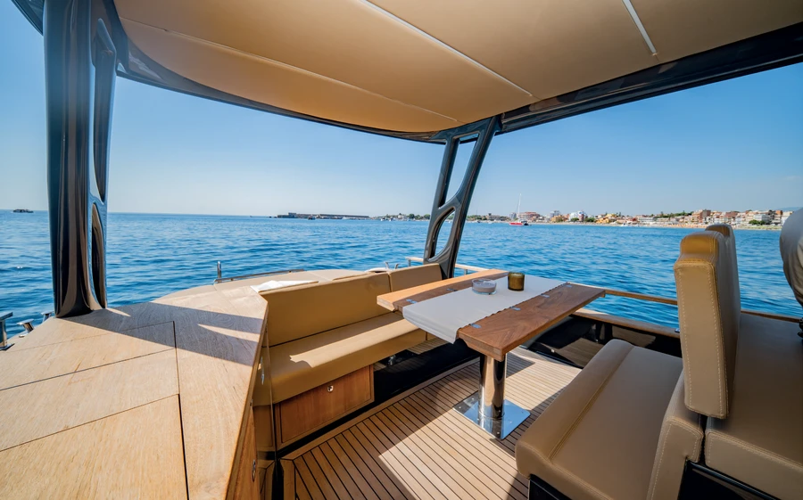 Shaded seating and wooden table on board