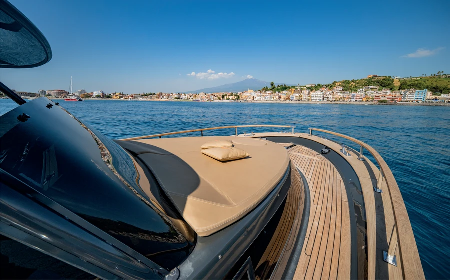 Forward sun pad and side deck overlooking the coast