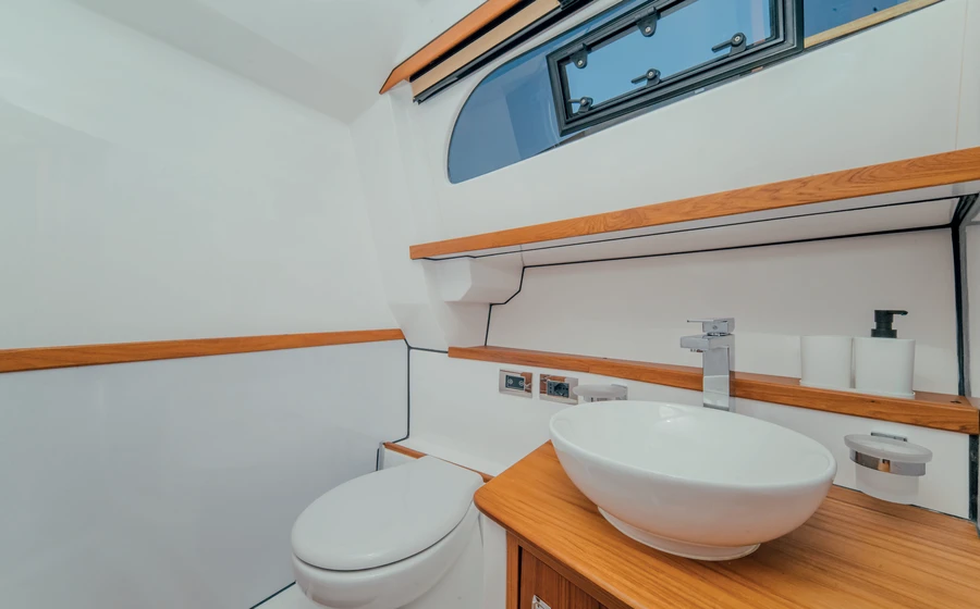 Bathroom with basin, mirror and toilet