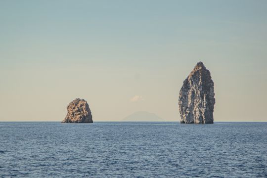 Two dramatic sea stacks standing offshore