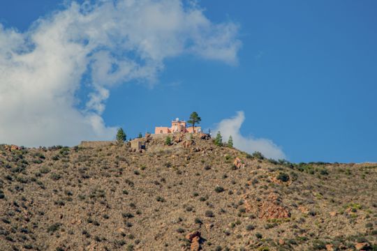 A small hilltop church overlooking the island coastline